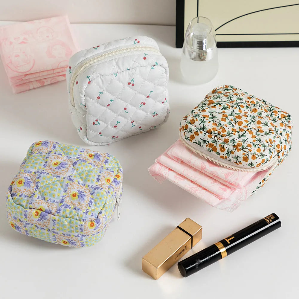 Women's floral patterned polyester key storage bag with sewing thread detail.