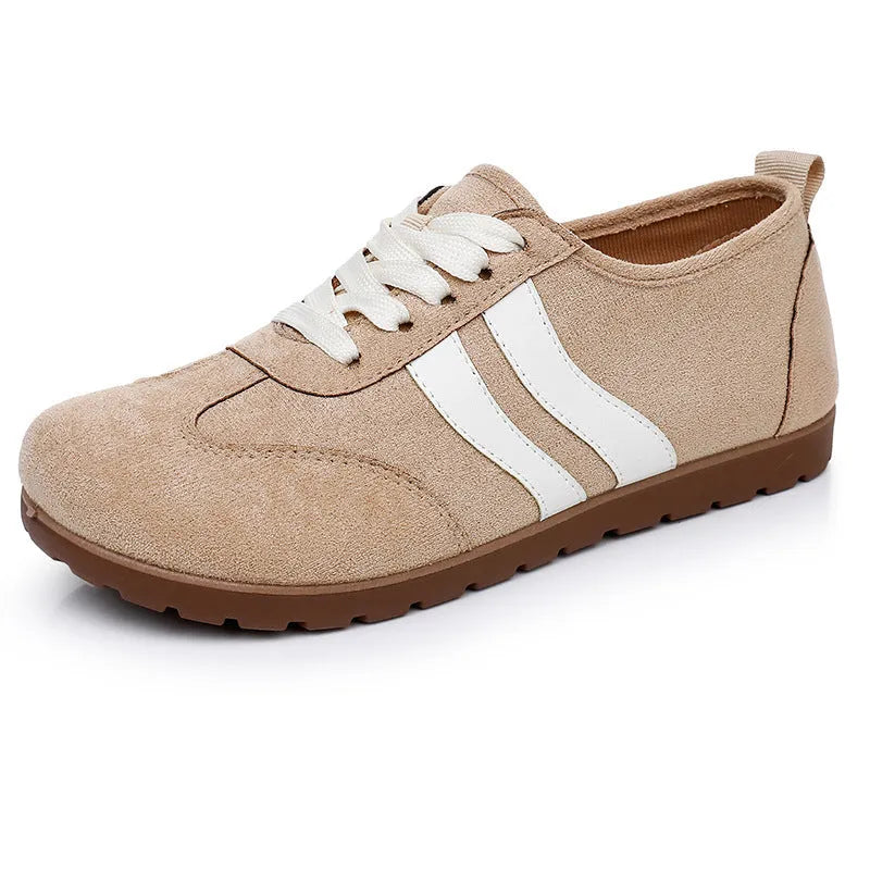 Women's vintage-style canvas sneakers with round toe and flat rubber sole in dark red.