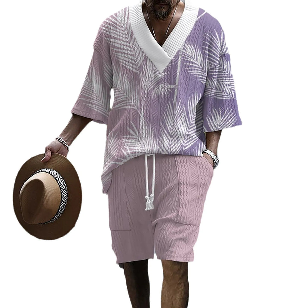 Printed men's knitted drop-shoulder short-sleeved top and matching shorts set in a polyester blend.