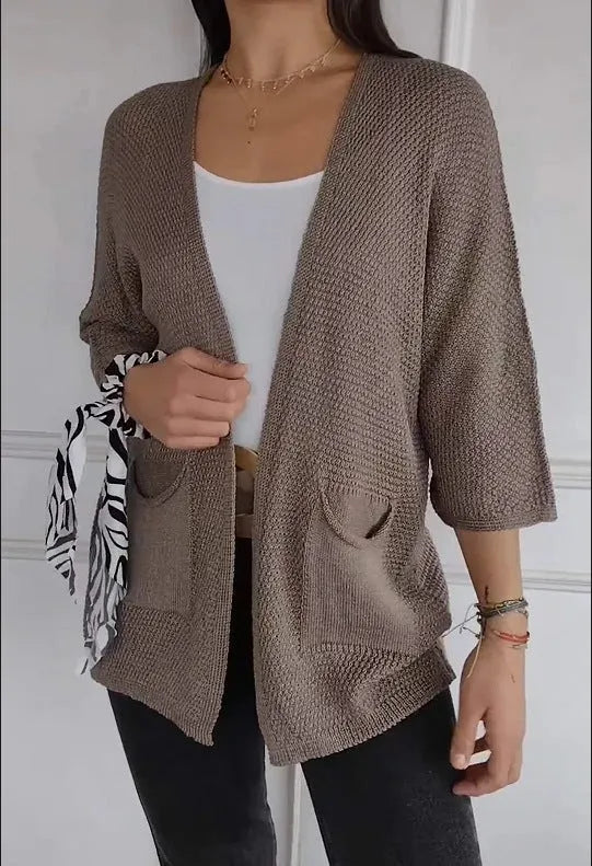 Women's thin waffle weave cardigan coat in army green with nine-quarter sleeves and pockets.