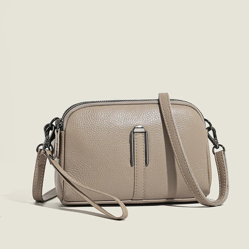 Women's genuine leather square shoulder bag in dark khaki colour, showing structured horizontal shape.