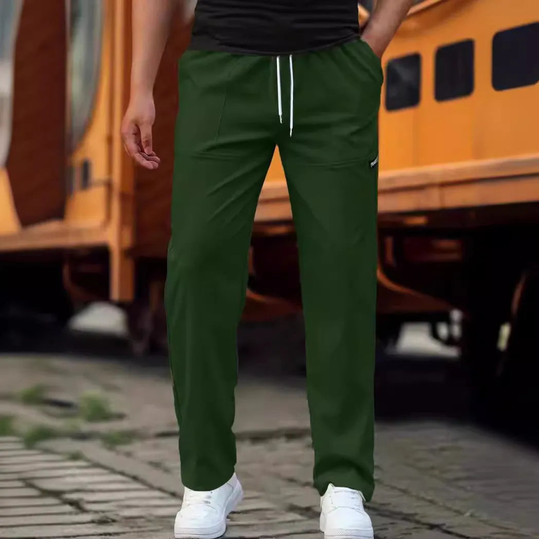 Men's casual polyester trousers for spring and autumn in light grey colour.