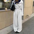 White striped wide-leg casual trousers with zipper detail shown in S/M/L sizes for commuting wear