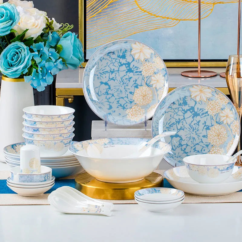 16 piece new bone china dinner set with bowls plates spoons and chopsticks on a table