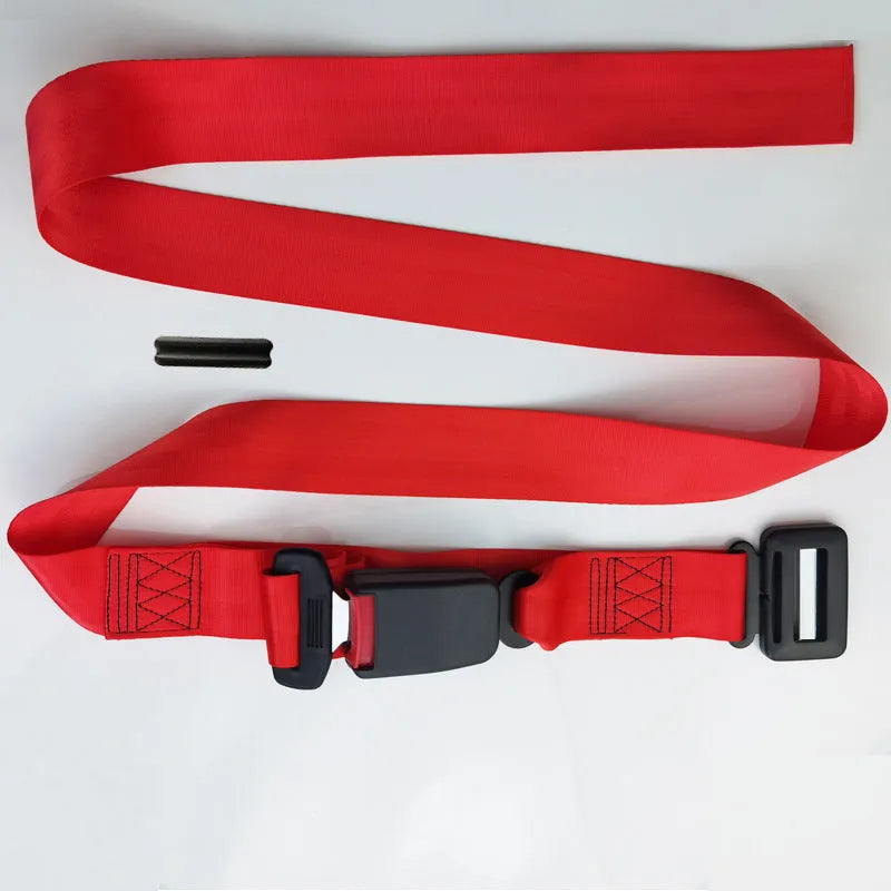 A beige press buckle maternal car seat belt support wrapped around a grey car seat.