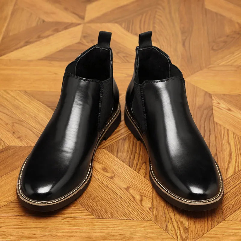 Men's black formal leather boots with a pointed toe and square heel on a non-slip rubber sole.