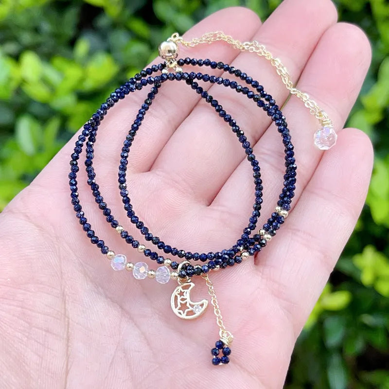 Handmade blue three-ring multi-layer bracelet for women on a wrist.