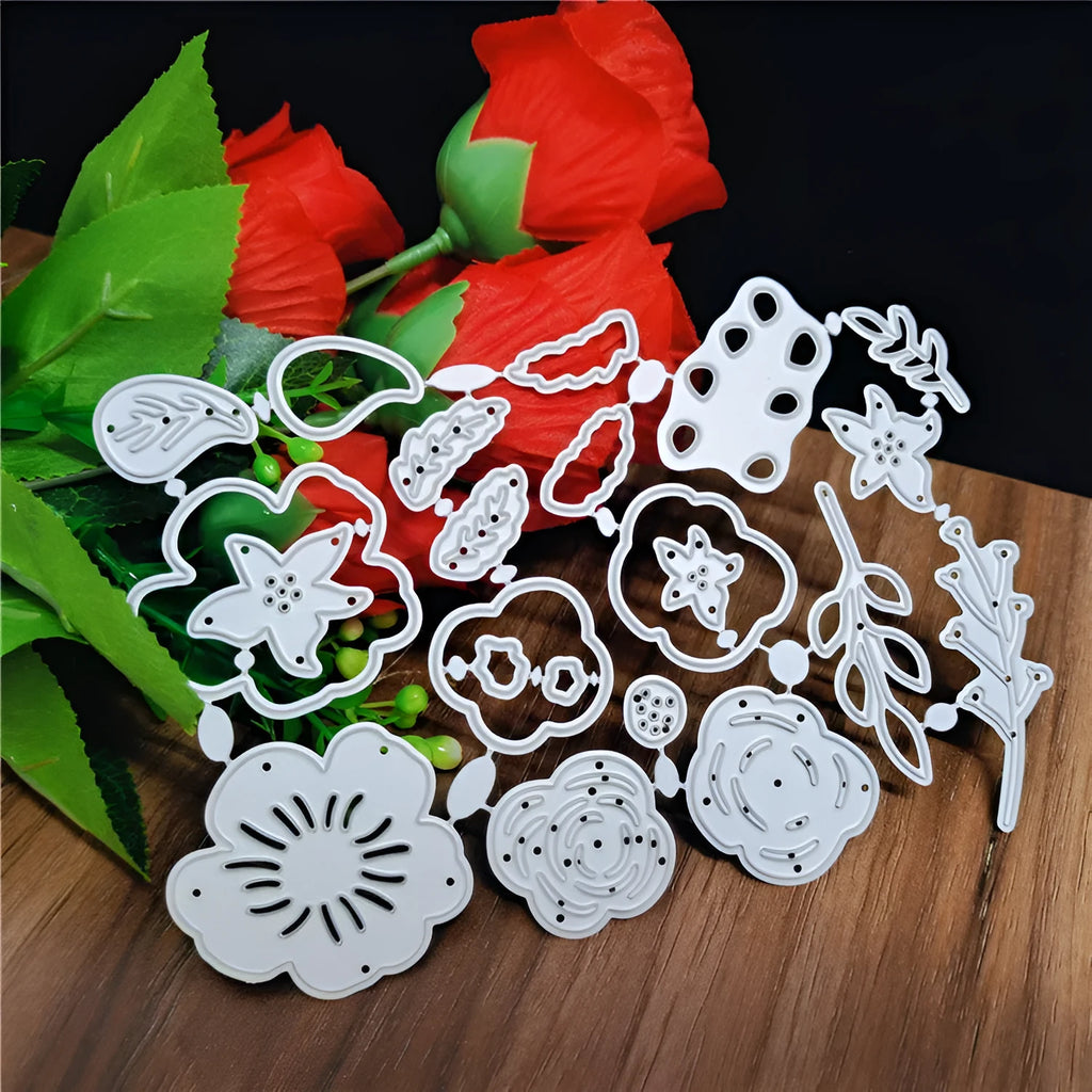Silver carbon steel craft die with etched flower design for paper cutting, measuring 14.3 by 9.9 cm.
