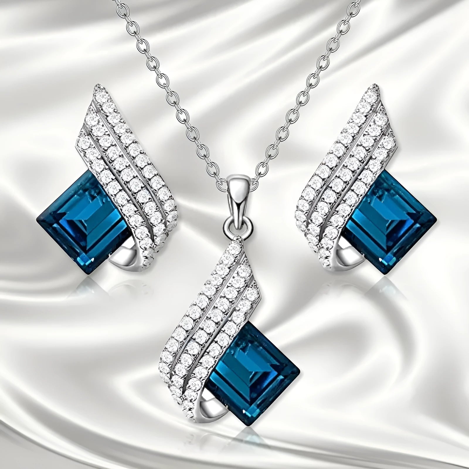Electroplated alloy necklace and earring set with glass pendant and cross chain design