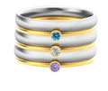 A geometric titanium steel ring featuring an engraved December birthstone design on a grey background.