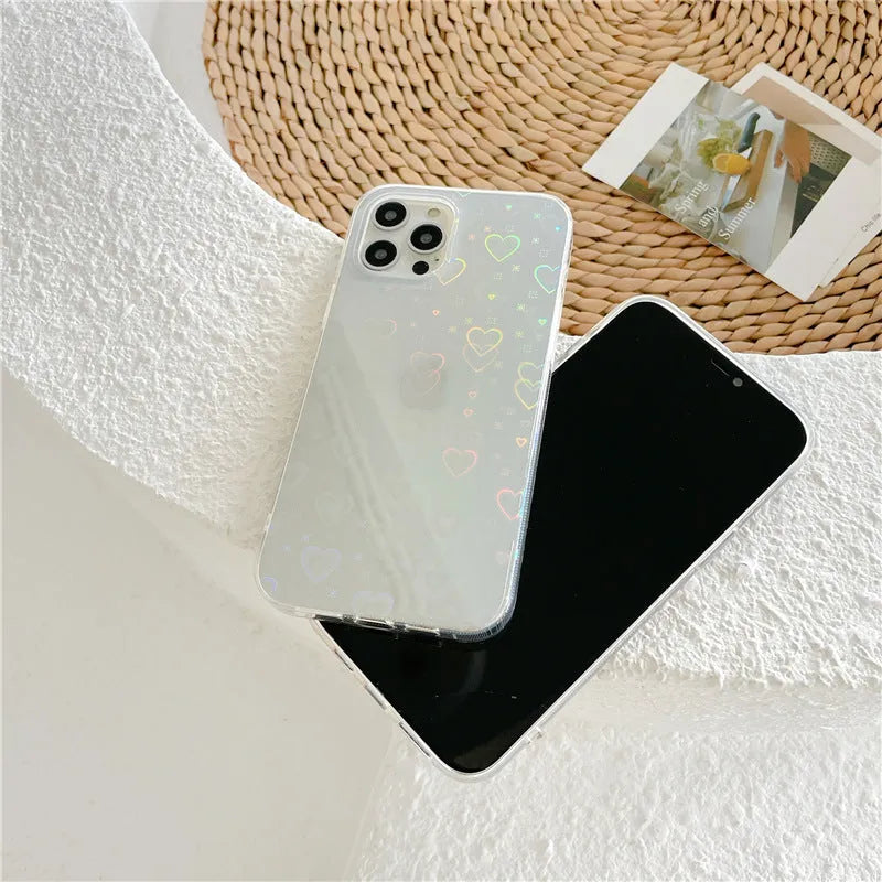 Transparent silicone iPhone case with laser-etched Love design on the back.