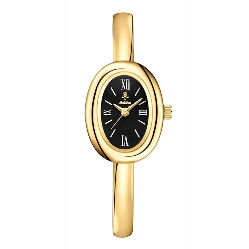 Women's slim oval retro quartz watch in gold colour on wrist