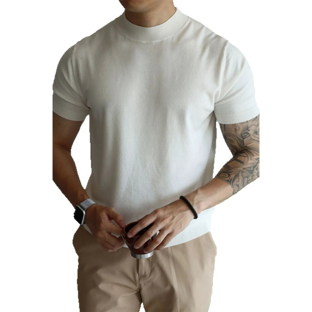 Man wearing a slim-fit solid colour polyester t-shirt, showcasing its lightweight knitwear construction.