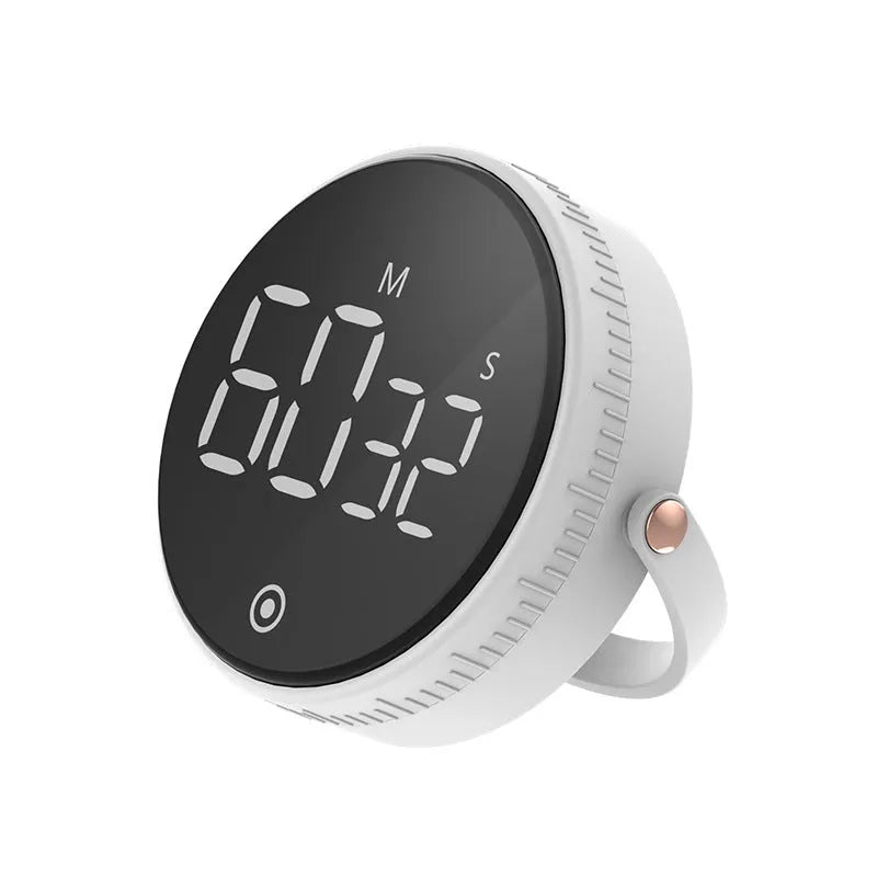 Black digital kitchen timer with rotary dial and LED display showing minutes and seconds