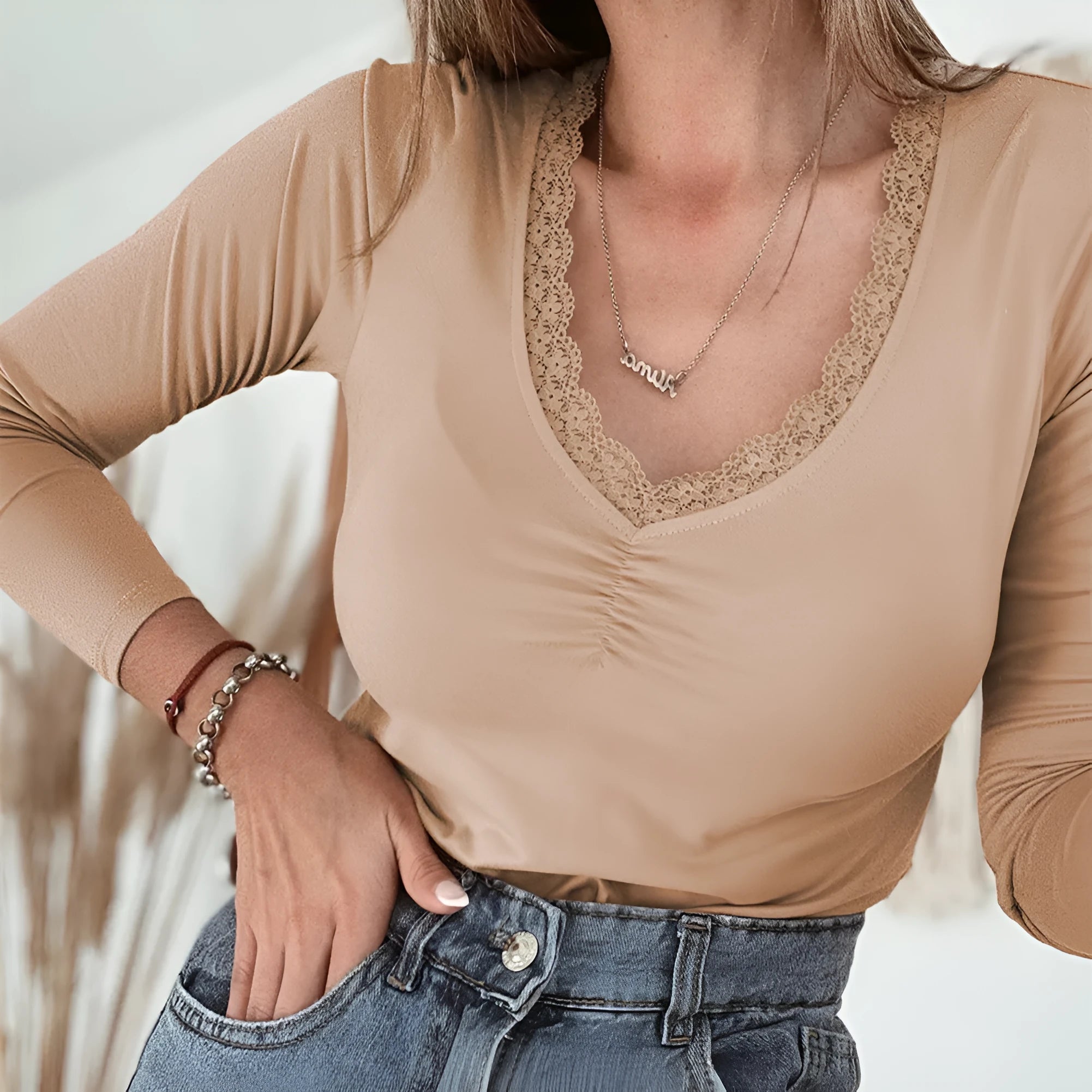 Women's solid colour long sleeve casual top with lace trim detail in slim fit silhouette