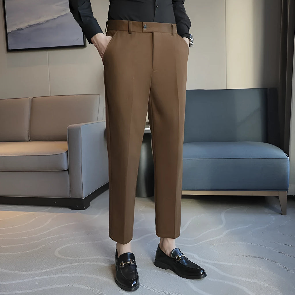 Men's straight fit brown corduroy trousers with elastic waistband on hanger
