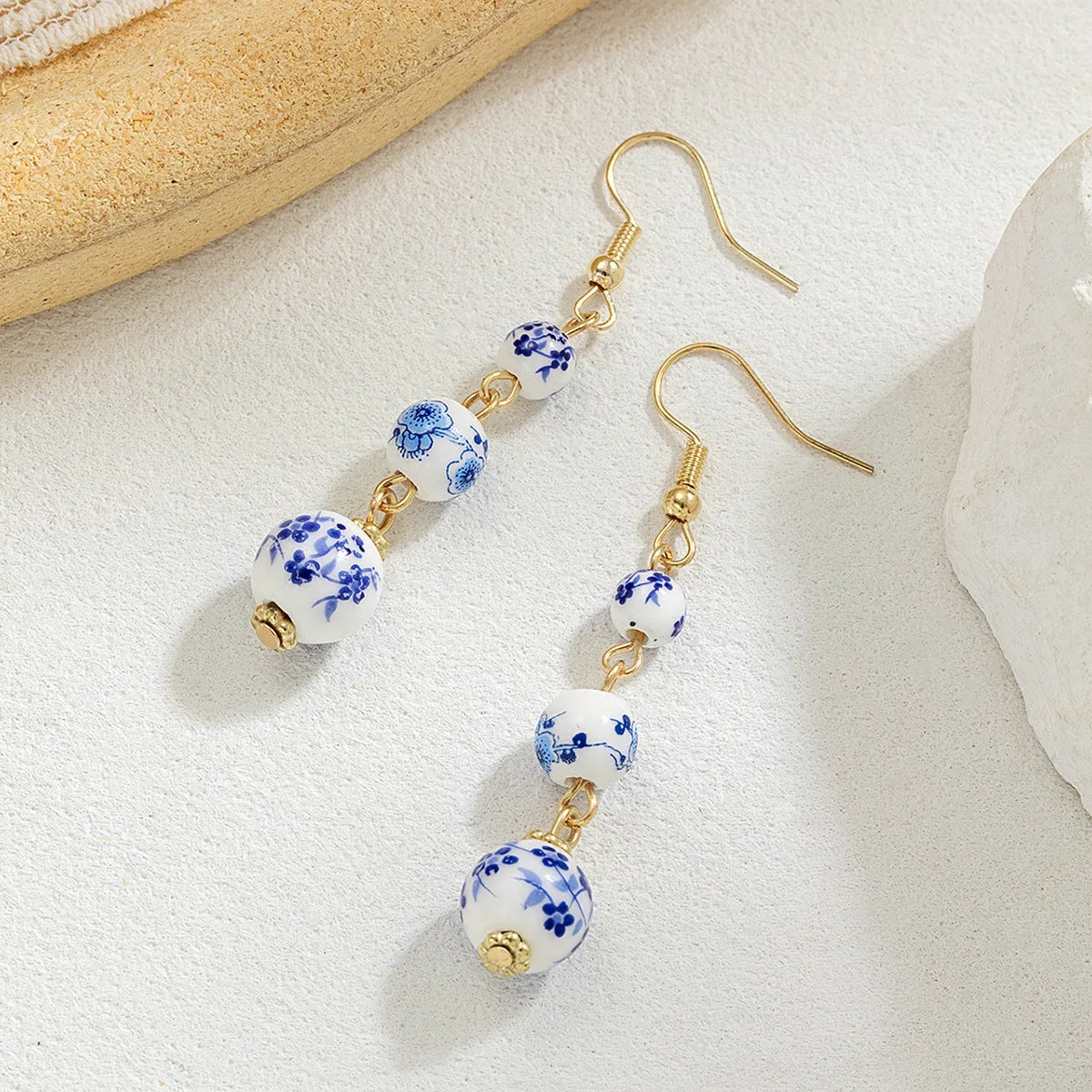 Blue and white porcelain ceramic bead long retro earrings with geometric round design and alloy electroplated finish