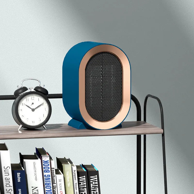 Desktop electric fan heater with a casting shell, showing mechanical dial and available in black, blue, green, or white.