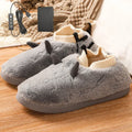 USB electric heating slippers in velvet, showing USB cable connection and adjustable temperature control.