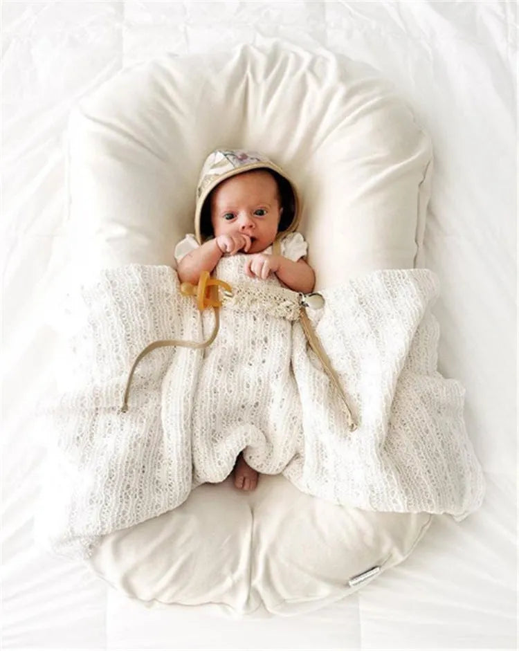 Portable cotton baby nest crib measuring 75x45cm with PP cotton filler in beige colour