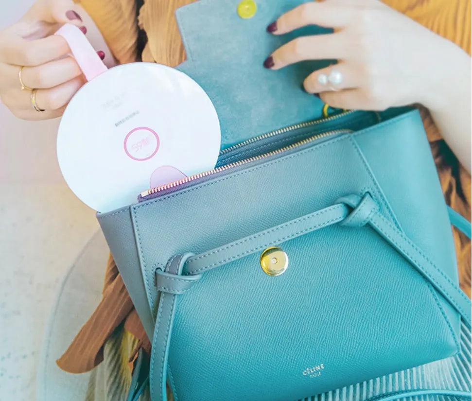 Portable UV baby bottle sterilizer showing compact design with USB port and measuring 163.6mm x 120mm