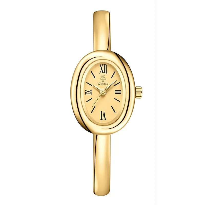 Women's slim oval retro quartz watch in gold colour on wrist