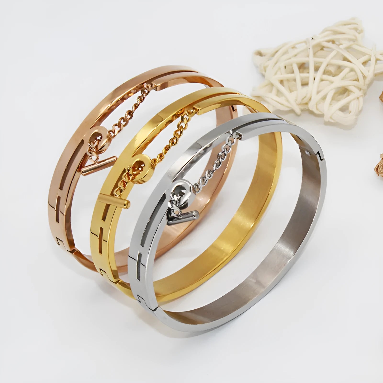 Geometric titanium steel bracelet in rose gold electroplated finish on white background