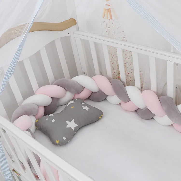 Braided knot crib bumper in spandex velvet, showing flexible length options for cot protection.