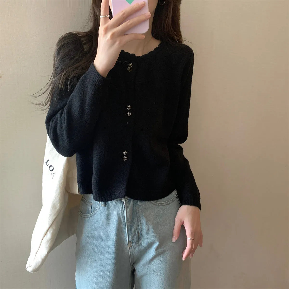 Women's long-sleeved acrylic cardigan coat in a solid colour, shown with a regular fit and cardigan front.