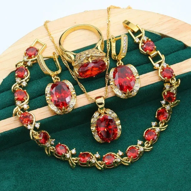 Full rhinestone zircon women's jewellery set showing necklace with snake bones chain, earrings, and ring in olive green or red.