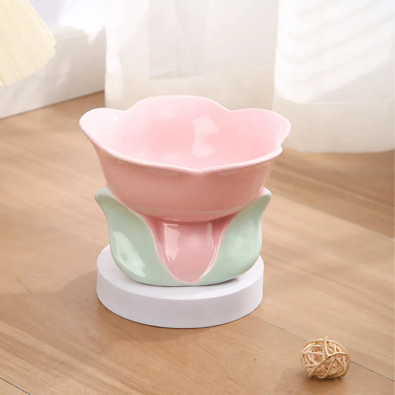 Blue floral patterned ceramic raised pet bowl with non-slip base for cats or small dogs.
