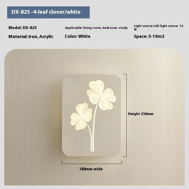 Modern bedside lamp with an acrylic shade showing a love heart motif and three-colour LED light.