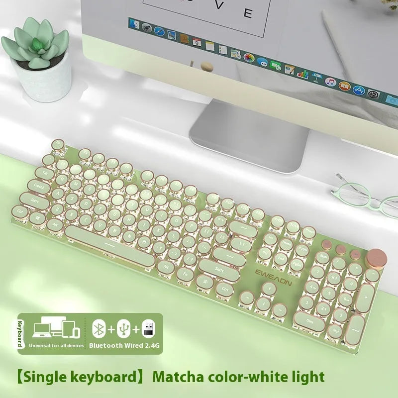 Matcha green mechanical gaming keyboard with white backlighting, aluminium panel, and multifunction knob on desk