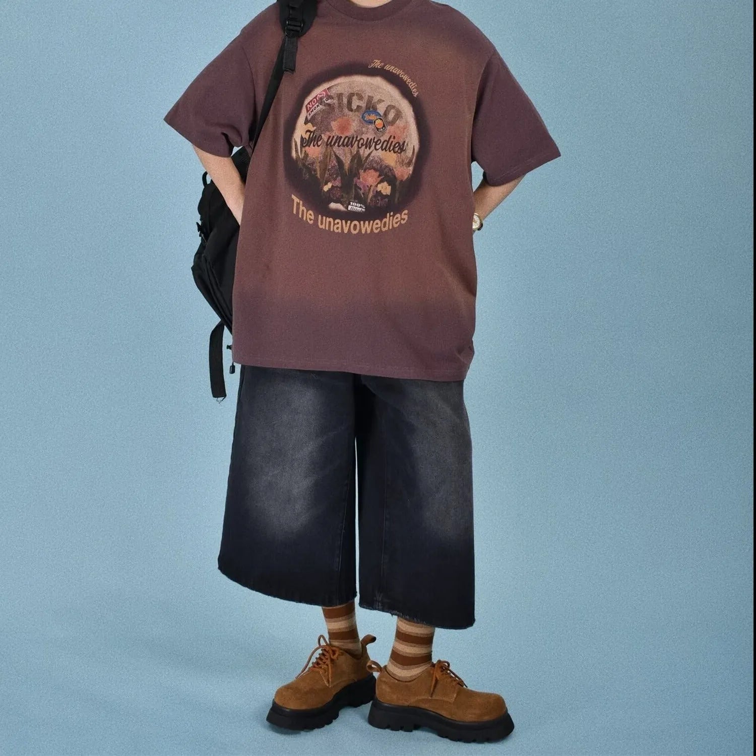 Men's straight-leg denim shorts in blue, shown with a loose fit for summer.