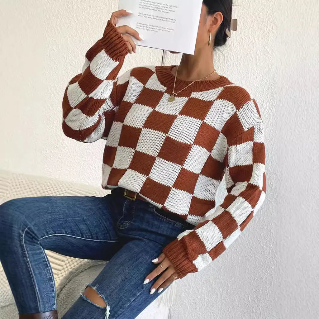 Dark brown plaid pattern loose fit pullover sweater with long sleeves and a round neck.
