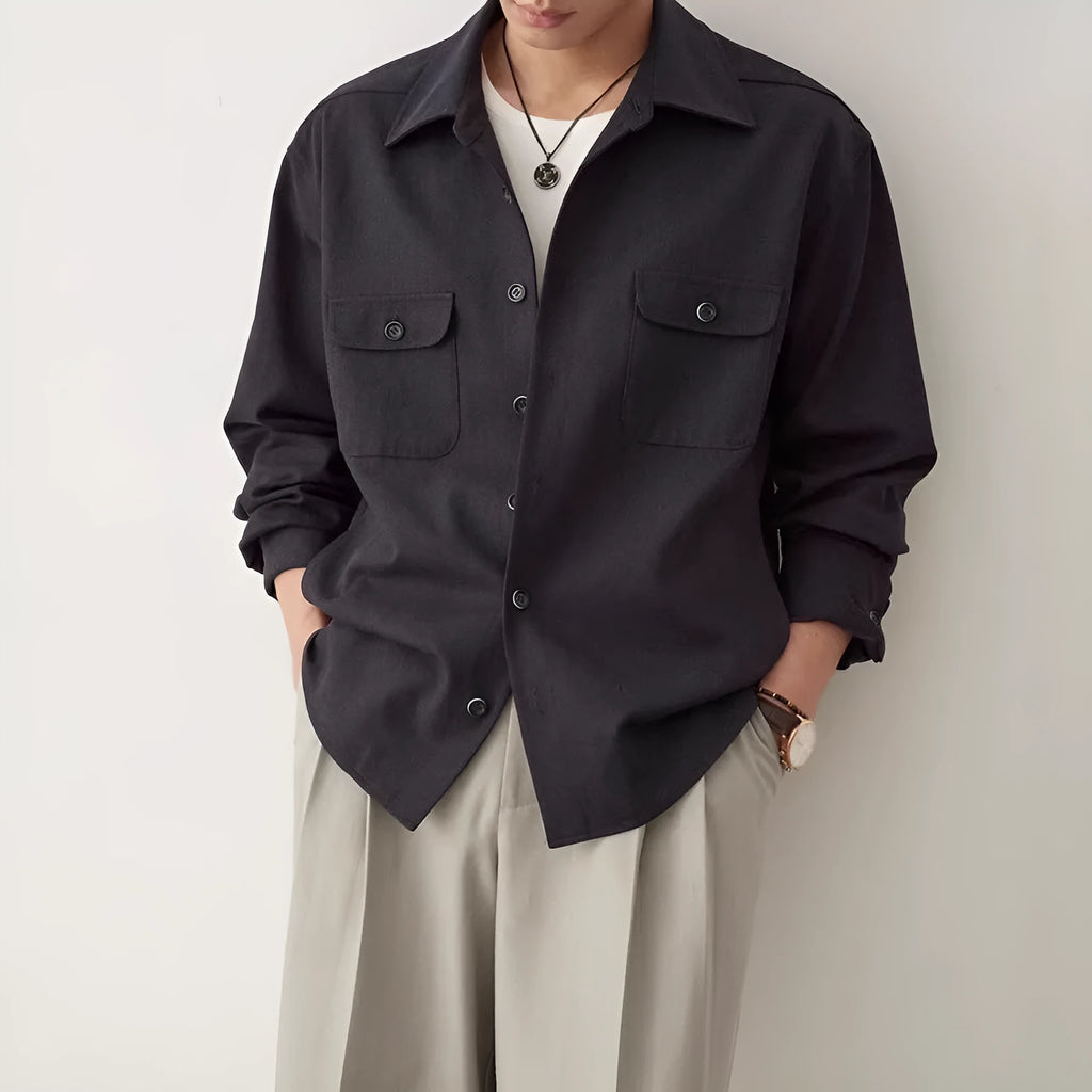 Men's simple profile lapel shirt in light sand rice colour, showing long sleeves and front button placket.