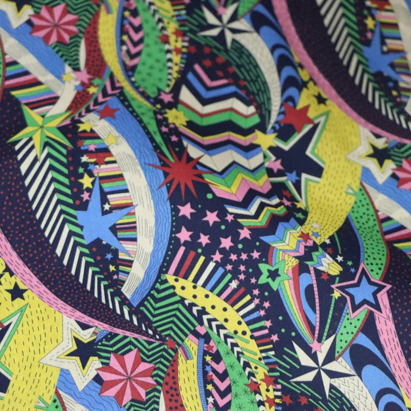 Blue floral print cotton fabric showing botanical designs on 145cm wide material