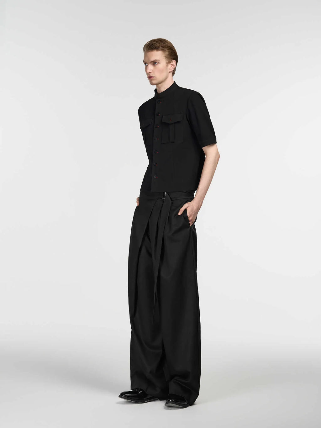 Black straight leg trousers with adjustable waistband and single pleated front detail