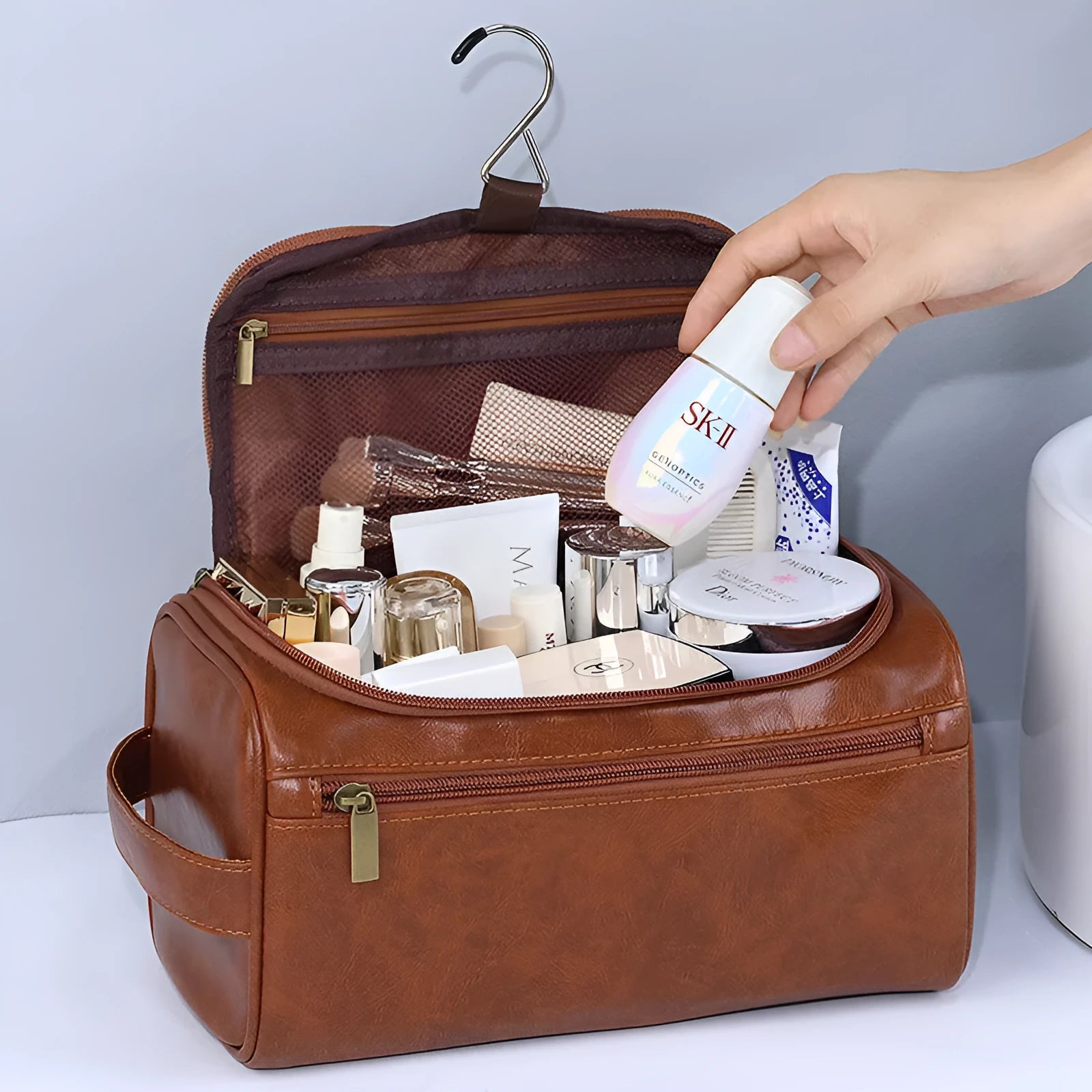 Waterproof cosmetic storage bag in brown PU leather with large capacity interior