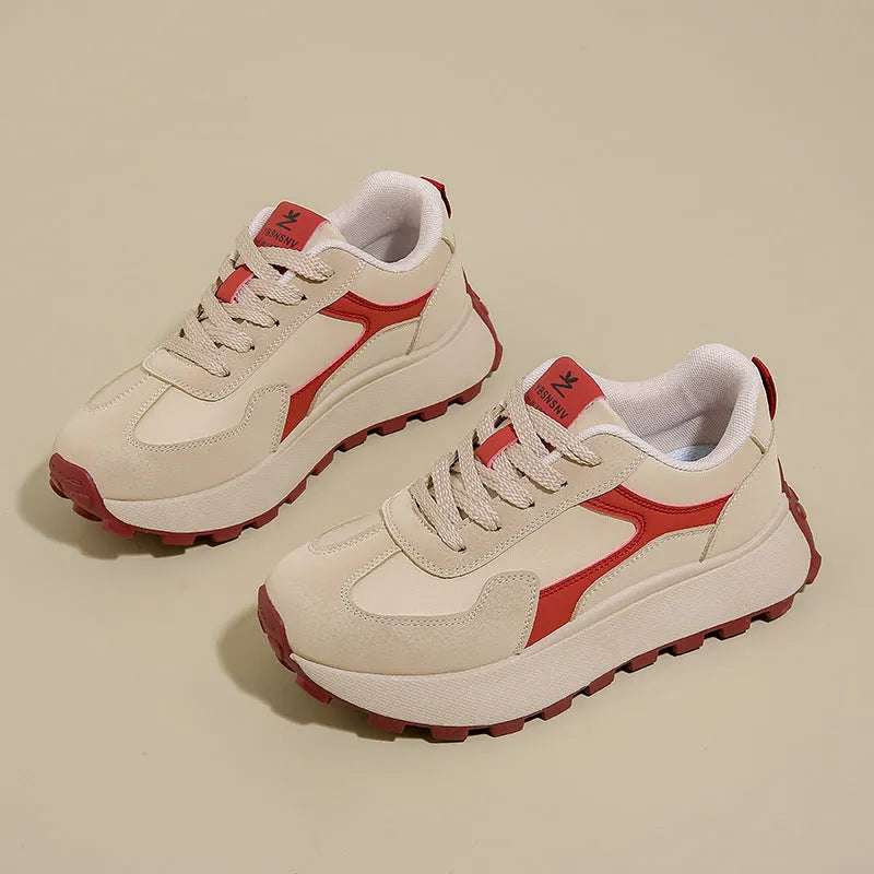 Women's solid-colour platform sneakers with mesh upper and flat rubber sole.