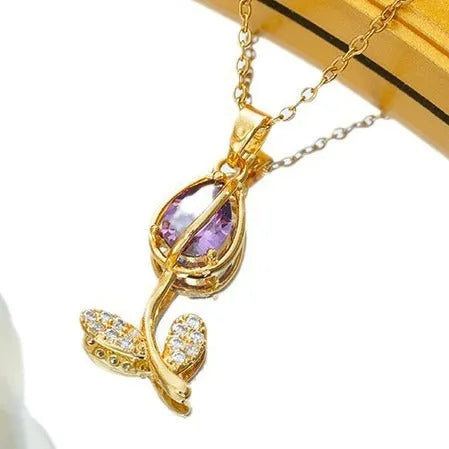 Gold-coloured tulip flower pendant necklace on a titanium steel chain for women.
