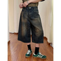 Men's straight-leg denim shorts in blue, shown with a loose fit for summer.
