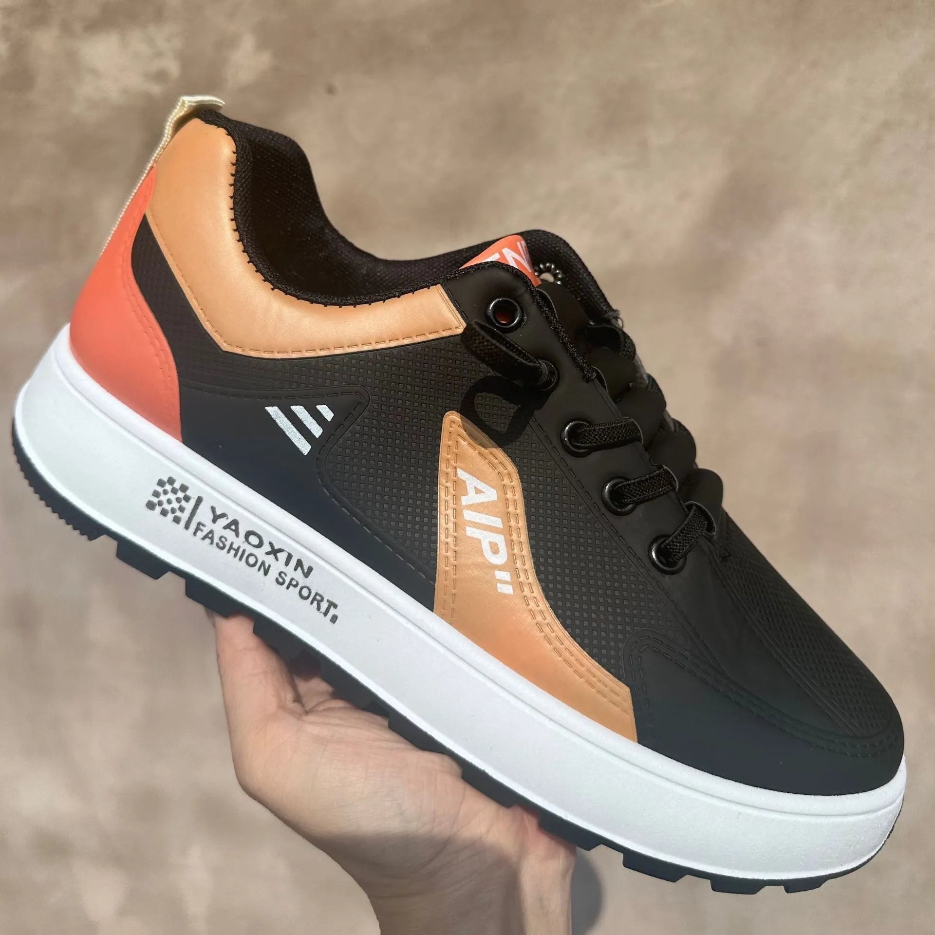 Men's white casual trainer with artificial PU upper and round toe, shown in orange, black, and brown trim colour options.
