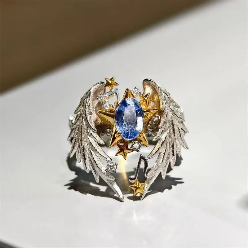 Adjustable angel wings ring with geometric design and open mouth construction