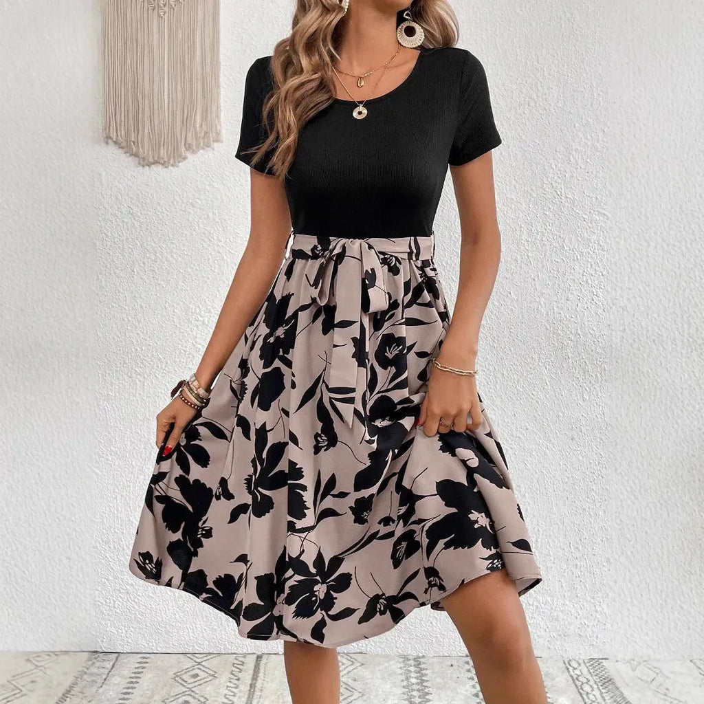 Women's khaki casual dress with floral print, A-line skirt, lace-up detail, and shoulder straps.