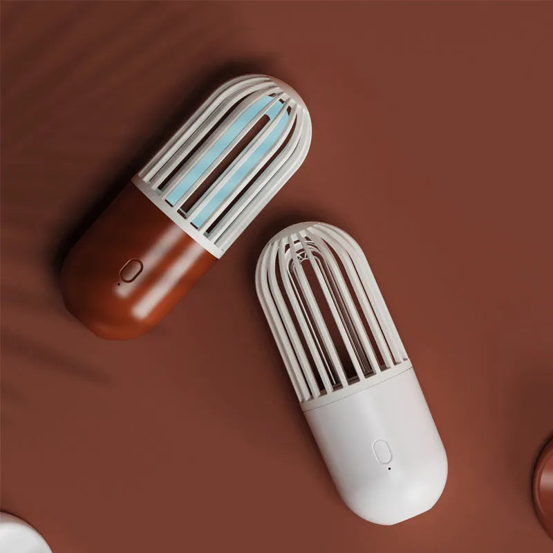 Portable capsule ultraviolet disinfection lamp in black, brown, green or white with compact 52x52x136mm body