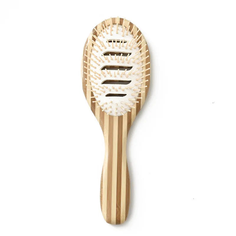 Natural bamboo scalp massage comb with round nylon teeth and rubber pad on neutral background