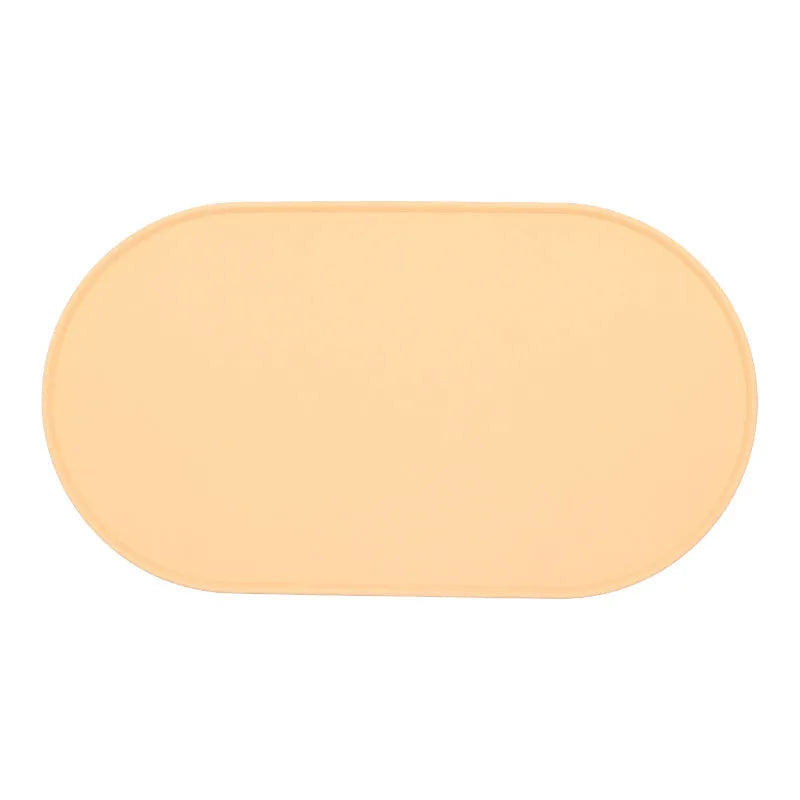 Silicone waterproof cat feeding placemat in beige colour on a wooden floor