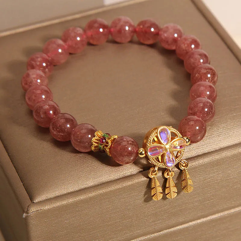 Women's crystal bracelet with strawberry quartz dream catcher ball pendant, original design.