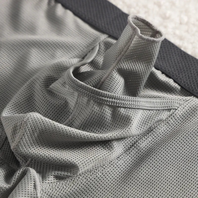 Men's low waist ice silk boxer briefs in black, shown flat.